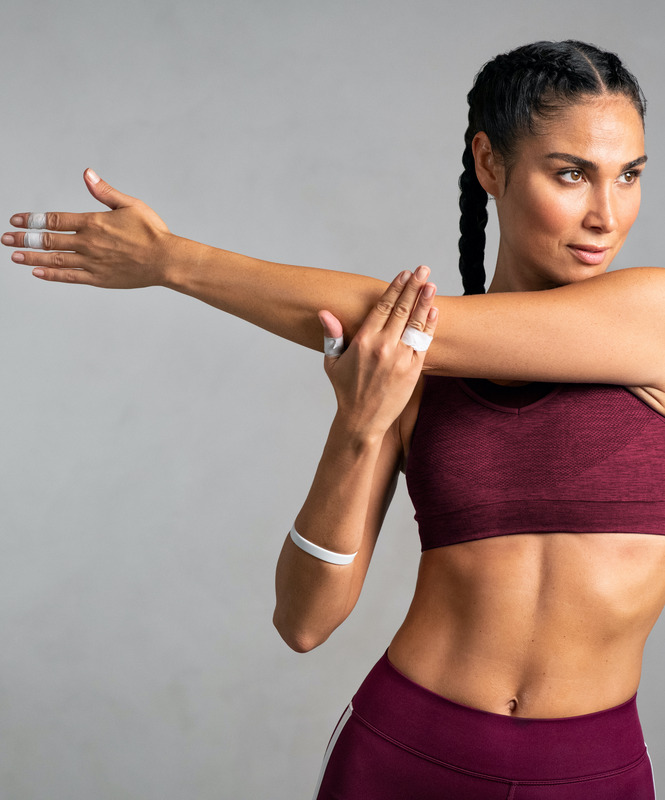 Photo of a woman in workout clothes stretching